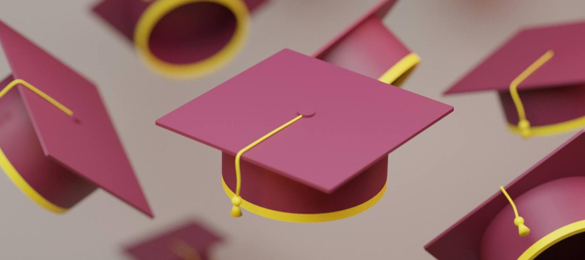 graduation caps flying in air